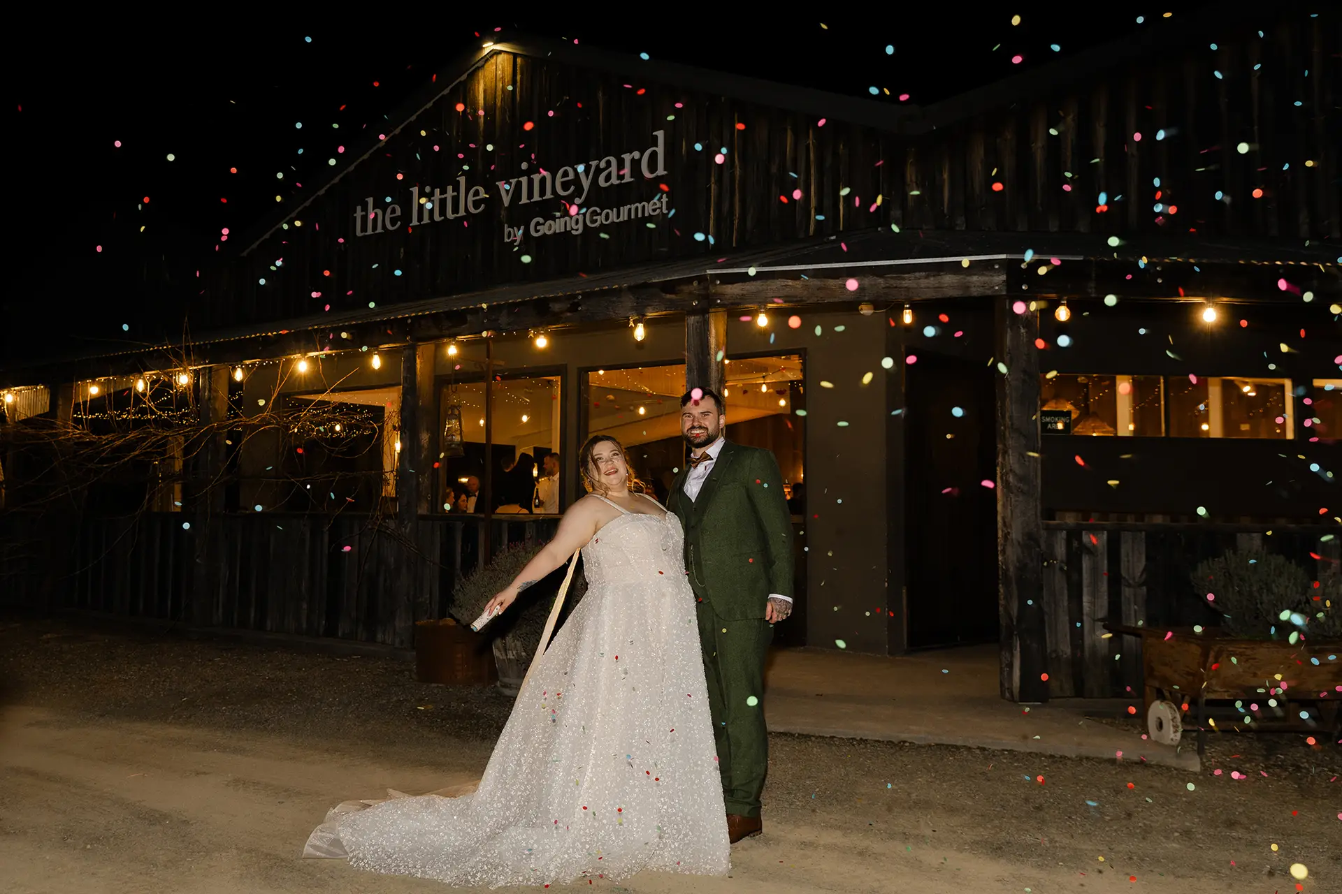Bride and groom having a coffetti celebration after their wedding, night time at the little vinyard, Yarra Valley