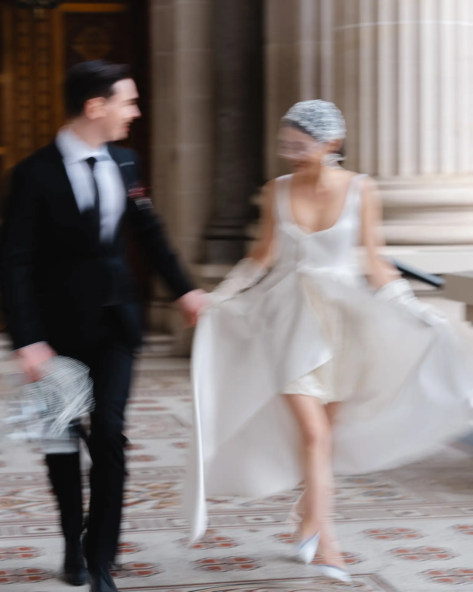 Bride and groom at the parliament building, blurry emotional portrait